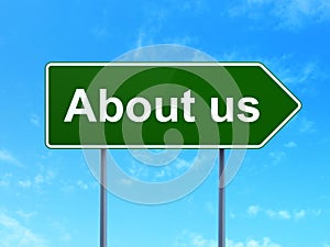 Business concept: About us on road sign background