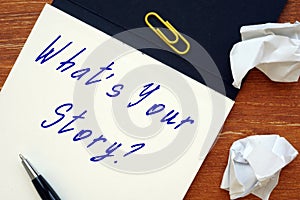 Business concept about What`s Your Story with inscription on the piece of paper