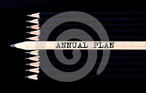 Business concept. White pencils with text ANNUAL PLAN on black background