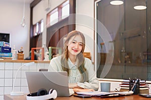 Business concept, Woman entrepreneur smiling and working with happiness in coworking space office