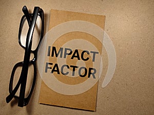 Business concept.Word IMPACT FACTOR