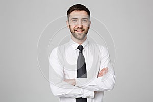 Business Concept - Young successful businessman posing over dark background. Copy space.