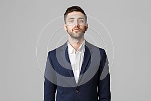 Business Concept - Young successful businessman posing over dark background. Isolated White Background. Copy space.