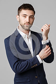 Business Concept - Young successful businessman posing over dark background. Isolated White Background. Copy space.