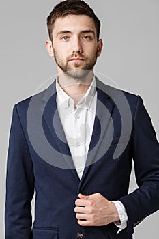 Business Concept - Young successful businessman posing over dark background. Isolated White Background. Copy space.