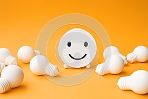 Business concepts with lightbulb and smiley face.inspiration and motivation.brainstorming and sharing ideas
