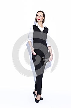 Business Concepts. Portrait of Positive Confident Caucasian Business Woman in White Shirt Posing With Clutch Over White