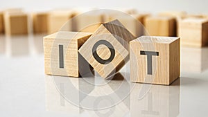 business conceptual word collected of wooden elements with the letters IOT