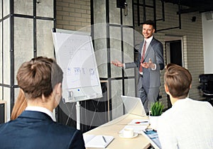 Business conference presentation with team training flipchart office.