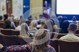 Business Conferences Concepts. Male Host Speakers Standing in Front on Stage