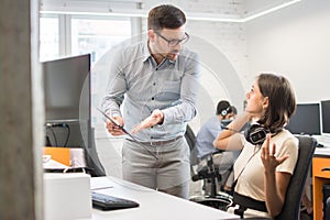 Business conflict. Business people arguing about document at the office.