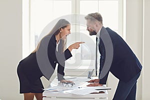 Business conflict. Competition conflict dispute business angry people at a table in an office