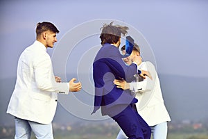 Business conflict. group of business people fighting on blue sky background, conflict
