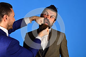 Business confrontation concept. Machos in classic suits photo
