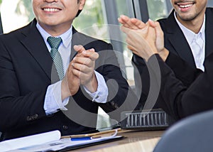 Business congratulation.asian business people team applauding in the meeting after finish project presentation