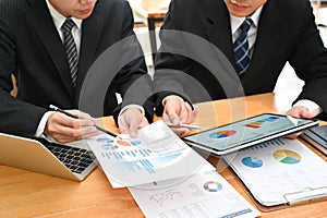 Business consult, Businessman working with finance document and tablet.