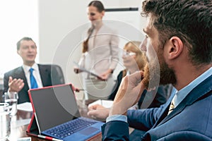 Business consultant listening to the manager of a corporation du