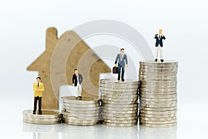 Business consultants on financial transactions for home loan, miniature people. Image use for financial, business concept photo