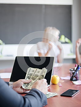 Business consultants while working in a team.A group of young workers at a meeting in the company conference room