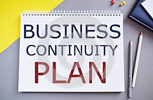 Business Continuity Plan text written in Notebook.Conceptual photo creating systems prevention deal potential threats