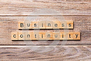 Business Continuity word written on wood block. Business Continuity text on wooden table for your desing, concept