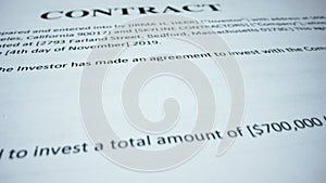 Business contract terms on paper sheet. Closeup person signing document with pen