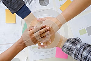 business cooperate hands join on office desk.