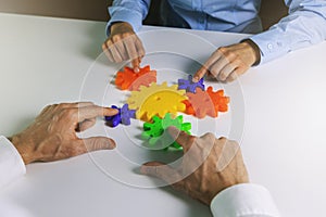 Business cooperation, strategy and teamwork concept. business people team joining gears