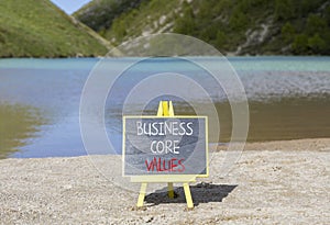 Business core values symbol. Concept words Business core values on beautiful black chalk blackboard. Beautiful mountain lake