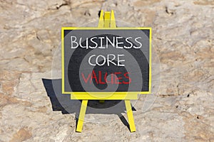 Business core values symbol. Concept words Business core values on beautiful black chalk blackboard. Beautiful stone background.