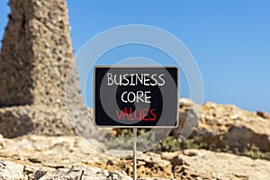 Business core values symbol. Concept words Business core values on beautiful black chalk blackboard. Beautiful stone blue sky