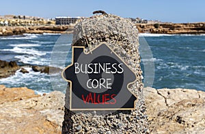 Business core values symbol. Concept words Business core values on beautiful black chalk blackboard. Beautiful stone sea sky