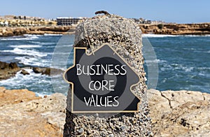 Business core values symbol. Concept words Business core values on beautiful black chalk blackboard. Beautiful stone sea sky