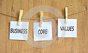 Business core values symbol. Concept words Business core values on beautiful white paper on clothespin. Beautiful wooden