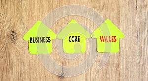 Business core values symbol. Concept words Business core values on beautiful yellow paper house. Beautiful wooden background.