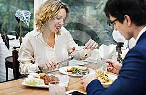 Business couple having dinner together