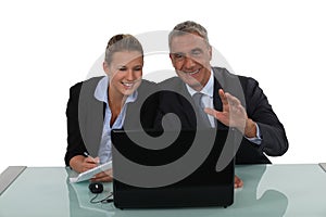 Business couple laughing