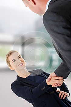 Business couple shaking hands