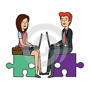 business couple sitting in puzzle piece with laptop