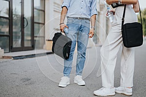 A business couple walks in the city center, discussing growth strategies and new project opportunities.