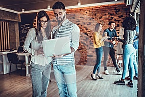 business couple working together on project at modern startup office