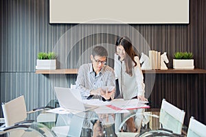 Business coworkers discussing in meeting room in office