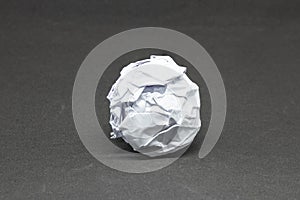 Business Creative and Idea Concept : Close up white crumpled paper ball on gray background.