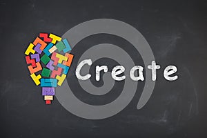 Business creative idea concept - inscription and jigsaw blocks on the blackboard