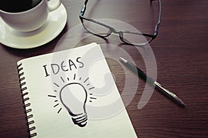 Business creativity concepts ideas.light bulb drawing on notepad