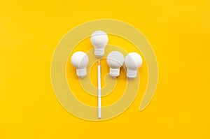 Business creativity and inspiration concepts with lightbulb and pencil on yellow background