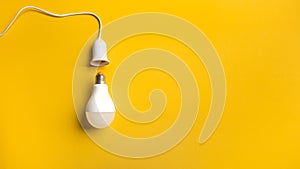 Business creativity and inspiration idea with lightbulb on yellow  background