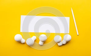 Business creativity / think outside the box concepts with lightbulb on yellow background