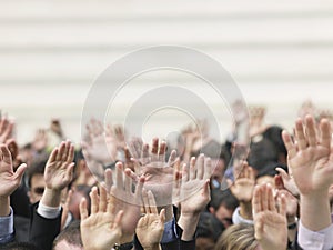 Business Crowd Raising Hands