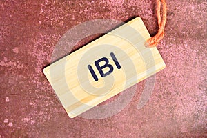 Business Customer Management Analysis Service. IBI on a card with a rope on an abstract background photo